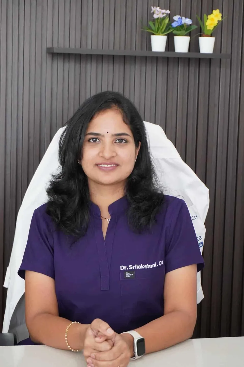 Dr. Srilakshmi Champati seated at Happy Smile Designers